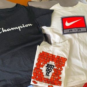 3 boys tshirts size Medium 1 Champions 2 nike